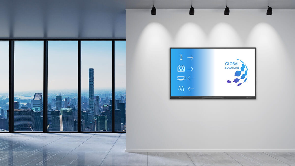 SMART NX series non-interactive display mounted on a wall in a modern office space, showcasing wayfinding signage.