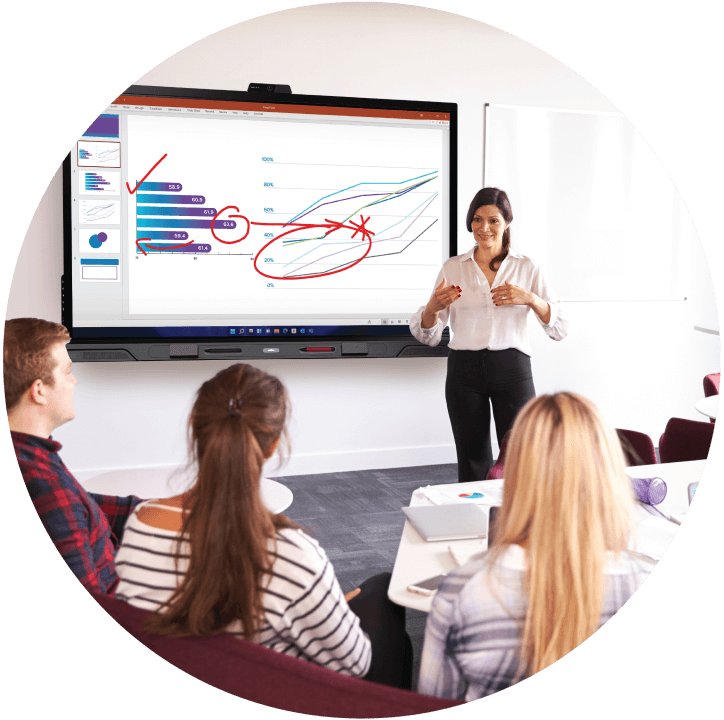 A presenter giving an ISE booth tour, demonstrating a SMART Board with interactive tools.